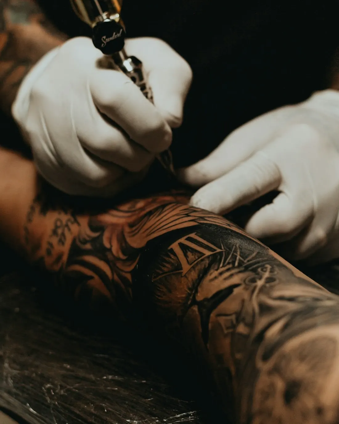 A tattoo artist at work