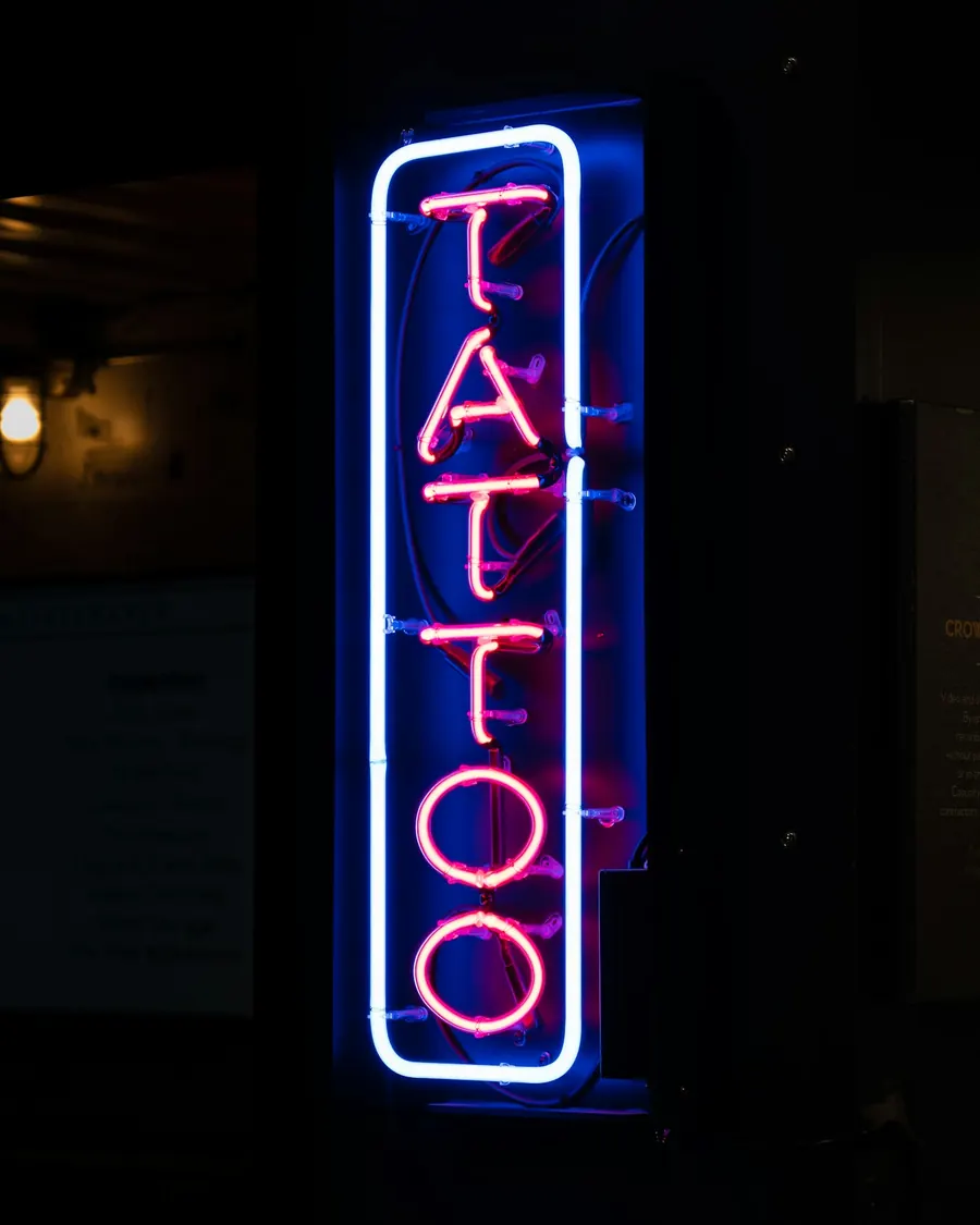 A neon 'Tattoo' sign